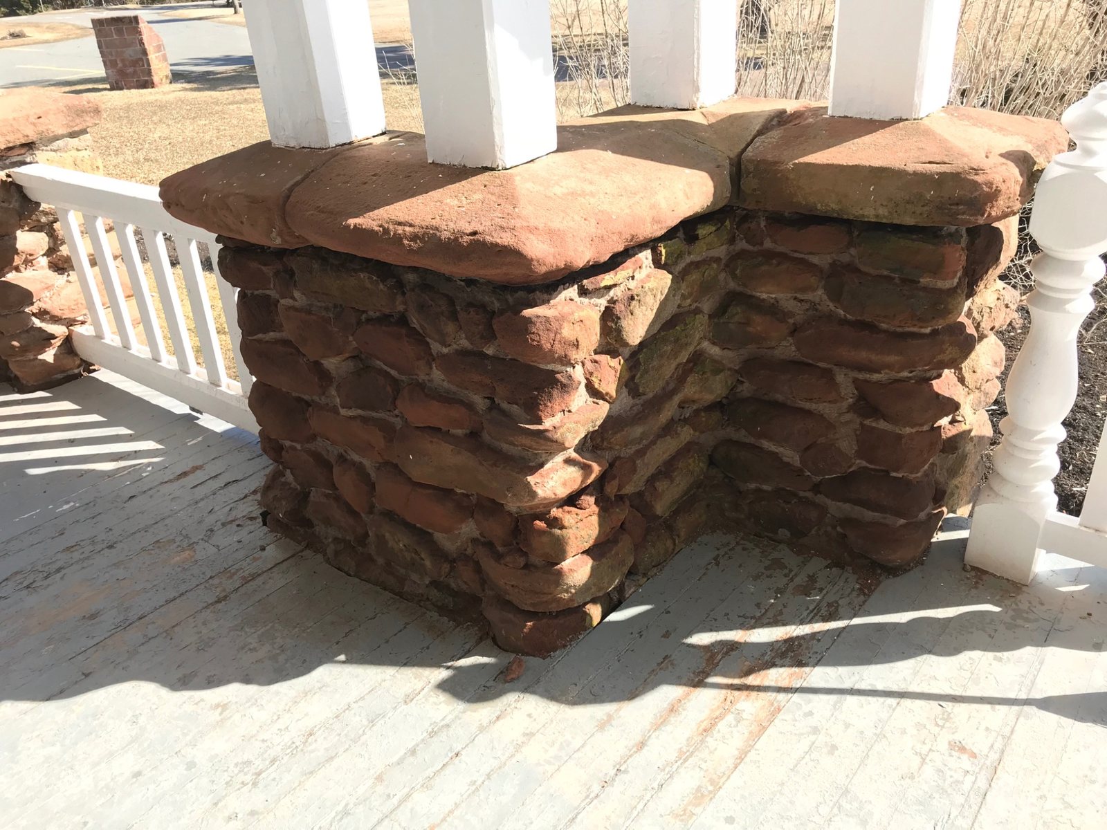 Historic sandstone pillar with carefully matched mortar joints during restoration
