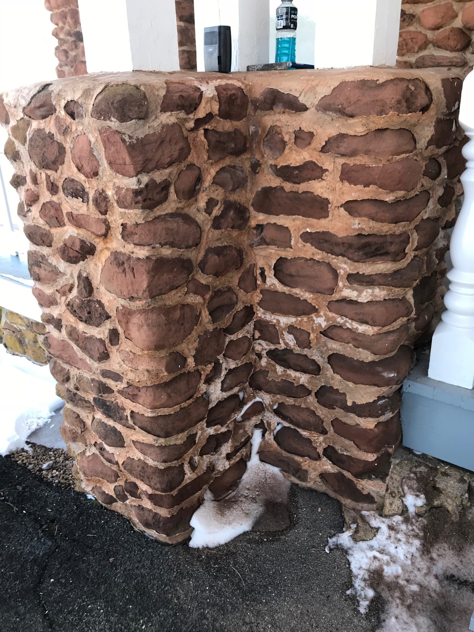 Sandstone pillar repointing at Dalvay by the Sea showing carefully finished joints during restoration work