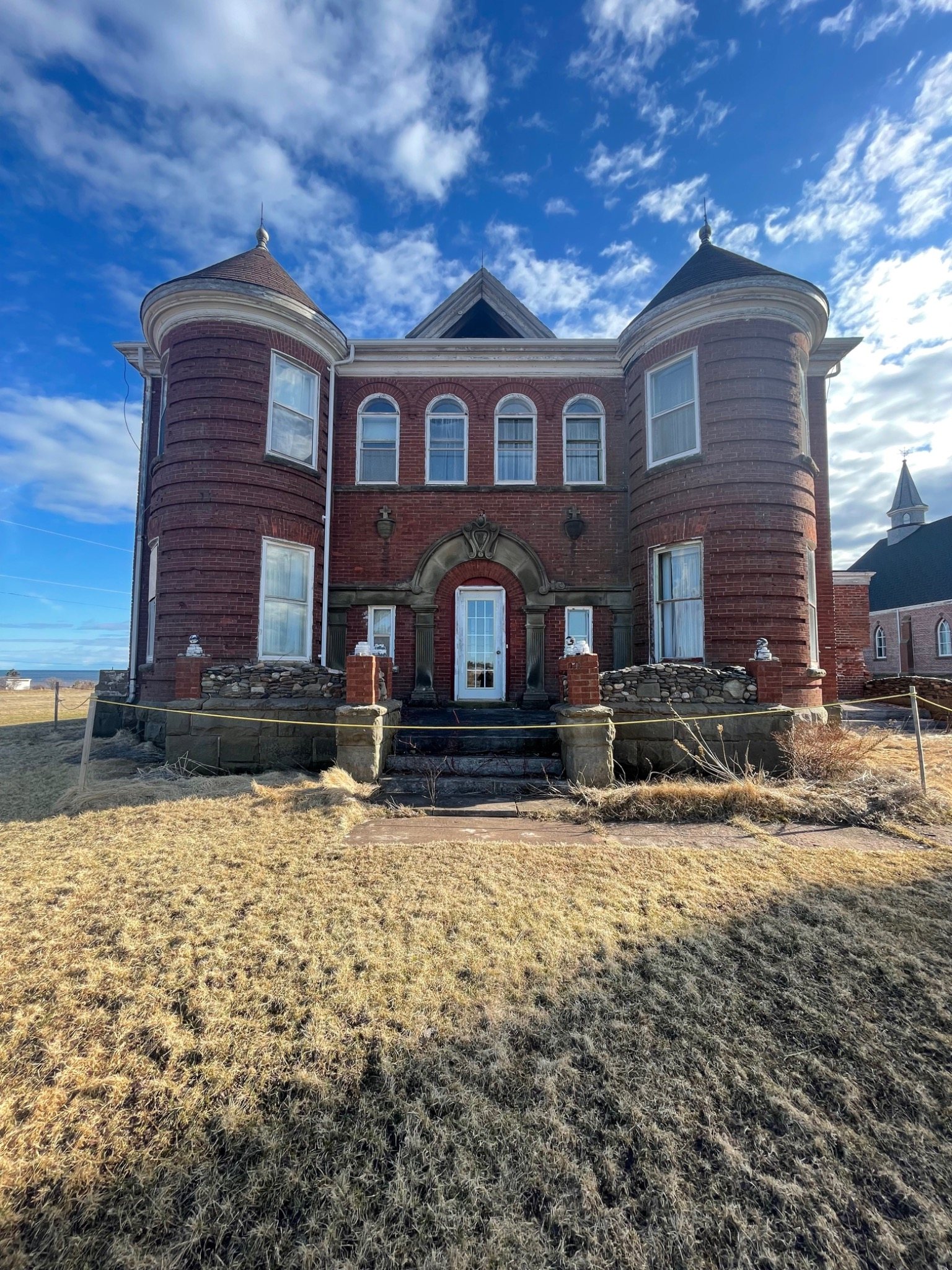 Current exterior of the 1902 Mont-Carmel Parish House during ongoing restoration