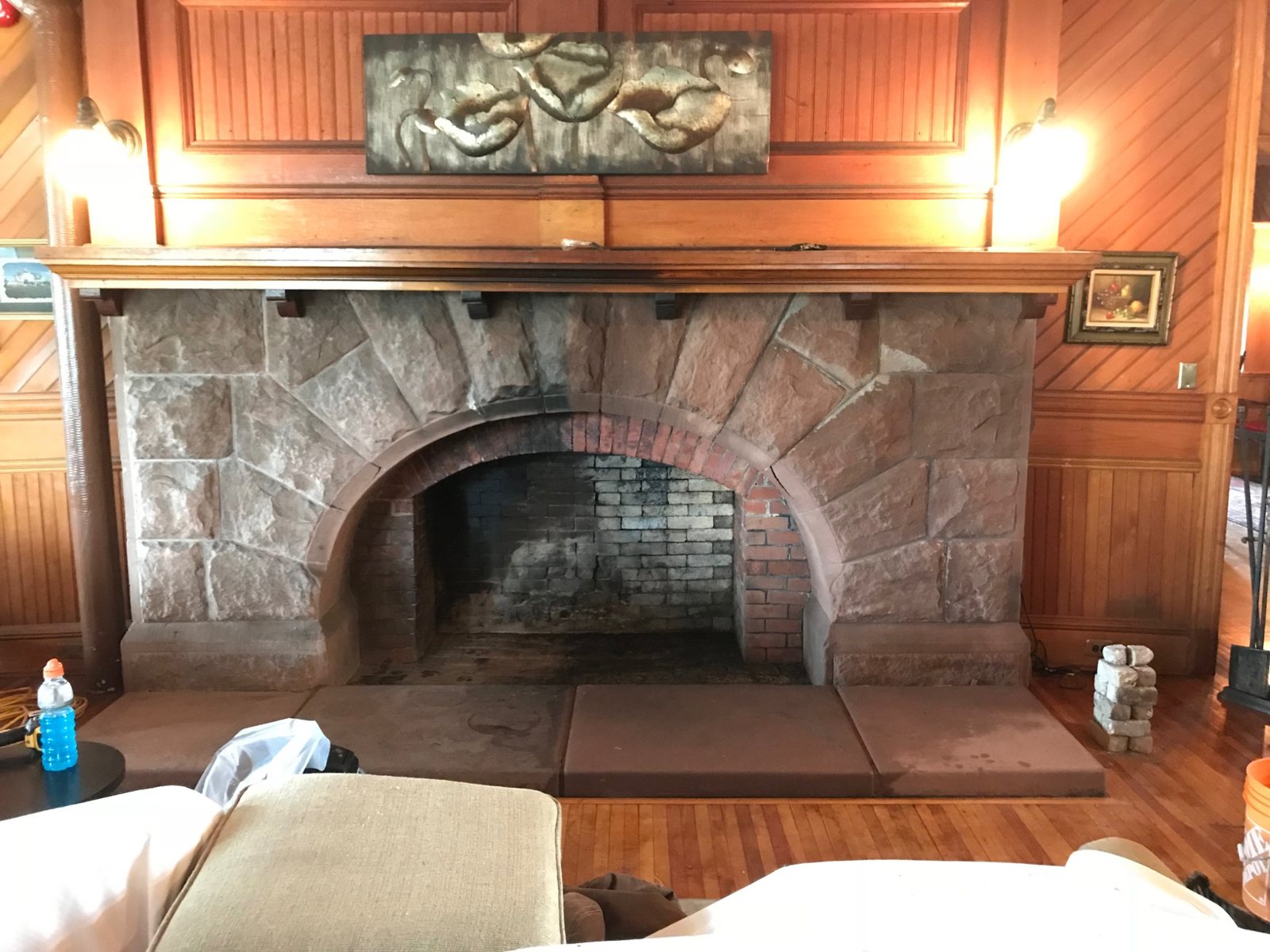 Factory-built fireplace heat circulator exposed during renovation